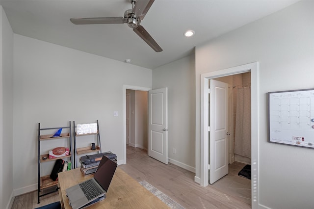 home office featuring light wood-style floors, recessed lighting, ceiling fan, and baseboards