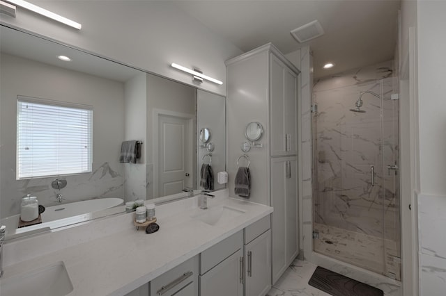 bathroom featuring marble finish floor, a sink, a marble finish shower, and double vanity