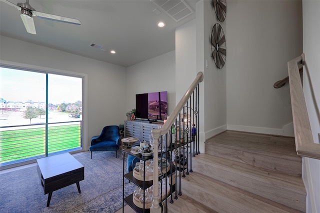 living room featuring recessed lighting, visible vents, baseboards, and wood finished floors