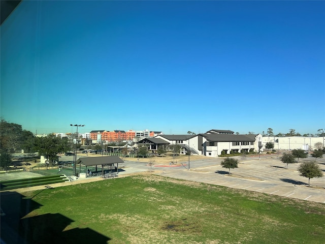 view of home's community featuring a yard