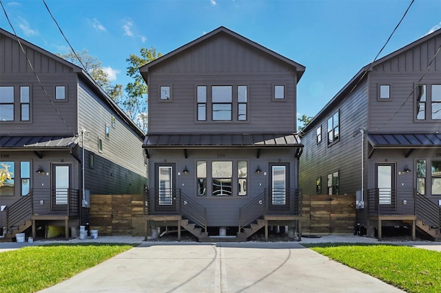 view of front of property featuring a standing seam roof and metal roof