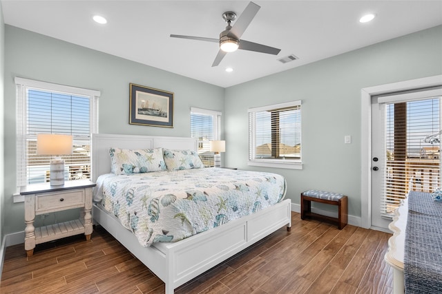 bedroom featuring access to exterior, baseboards, visible vents, and wood finished floors