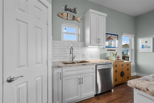 22318 Vista Del Mar, Galveston, TX 77554 - kitchen featuring tasteful backsplash, white cabinetry, dark wood finished floors, dishwasher, and a sink