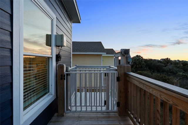 view of balcony at dusk