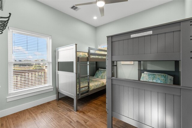 22318 Vista Del Mar, Galveston, TX 77554 - bedroom with visible vents, baseboards, multiple windows, and wood finished floors