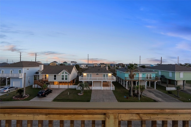 22318 Vista Del Mar, Galveston, TX 77554 - exterior space with a residential view, driveway, and a lawn