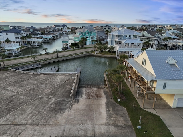 aerial view featuring a water view and a residential view