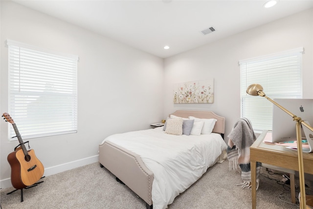 bedroom featuring recessed lighting, baseboards, visible vents, and light colored carpet