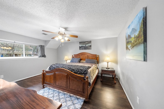 bedroom with dark wood-style flooring, visible vents, and baseboards