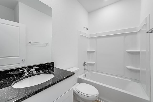 bathroom featuring vanity, bathing tub / shower combination, and toilet