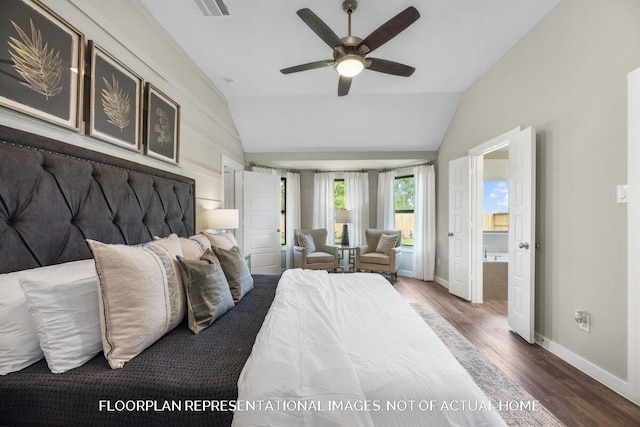 bedroom featuring visible vents, baseboards, lofted ceiling, wood finished floors, and ensuite bathroom