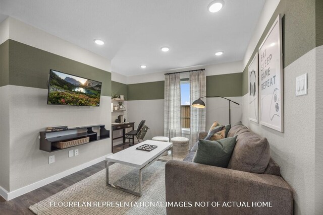 living room with recessed lighting, baseboards, and wood finished floors