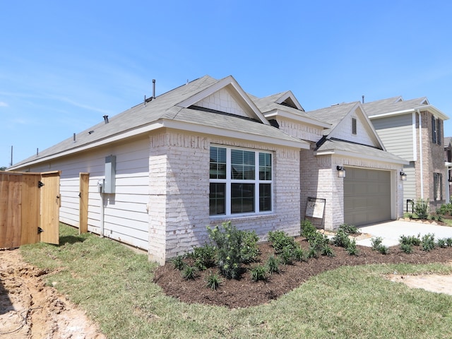 22431 Birchfield Grove Ln, New Caney, TX 77357 - view of side of home with driveway and a garage