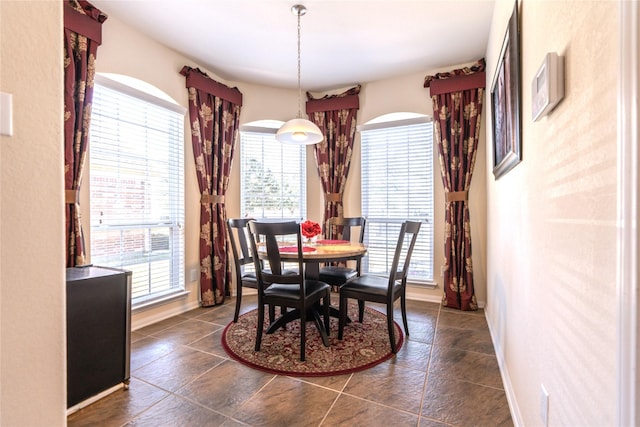 dining space featuring baseboards