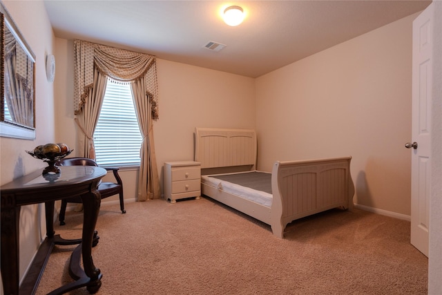 bedroom featuring light carpet, baseboards, and visible vents