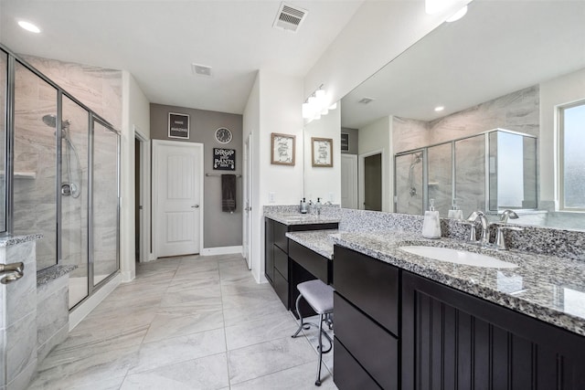 full bath featuring a stall shower, visible vents, and vanity