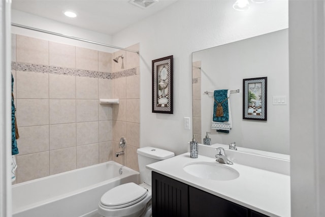 bathroom featuring toilet, bathtub / shower combination, visible vents, and vanity