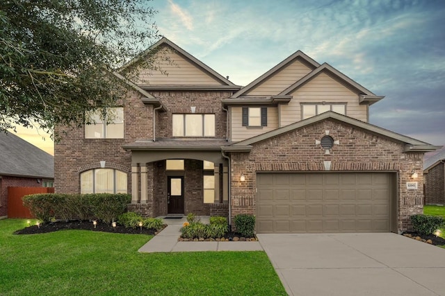 view of front of property with a front yard, brick siding, and driveway