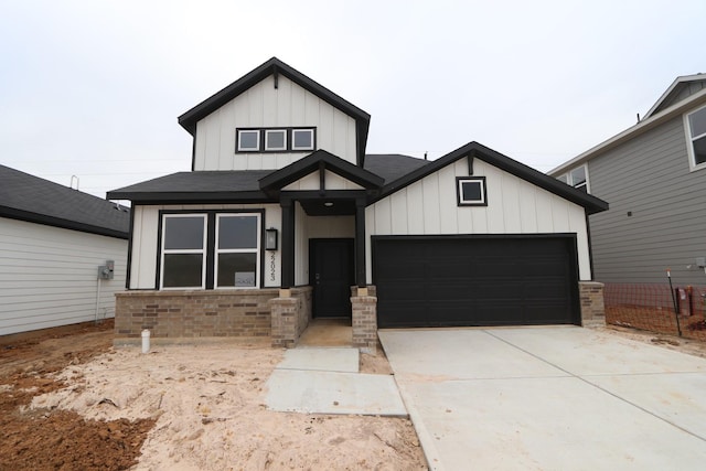 modern inspired farmhouse with a garage, board and batten siding, and concrete driveway