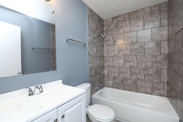 bathroom featuring bathtub / shower combination, vanity, and toilet