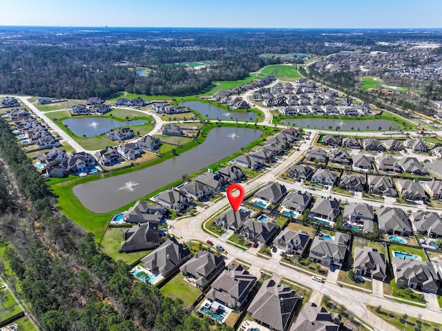 bird's eye view with a water view and a residential view