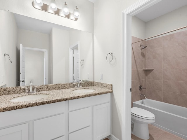 bathroom featuring double vanity, a sink, bathing tub / shower combination, and tile patterned floors