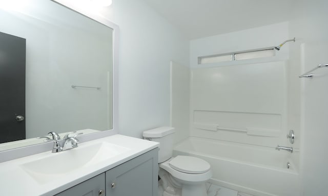 full bath with toilet, marble finish floor, shower / washtub combination, and vanity