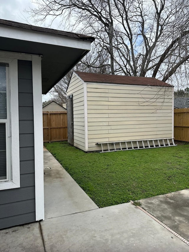 view of shed with fence