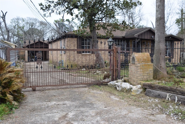 view of gate featuring a fenced front yard