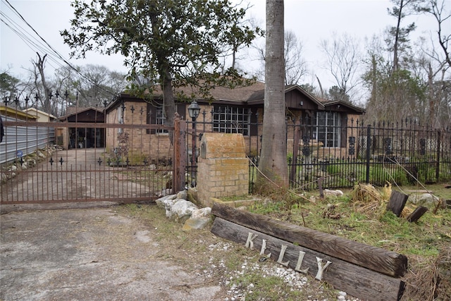 view of front of home featuring a fenced front yard and a gate