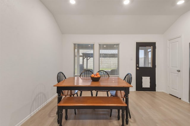 dining area featuring lofted ceiling, light wood-style flooring, baseboards, and recessed lighting