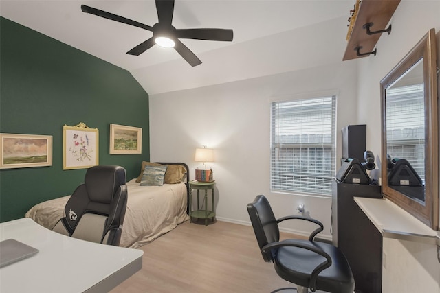 bedroom with lofted ceiling, ceiling fan, light wood-style flooring, and baseboards