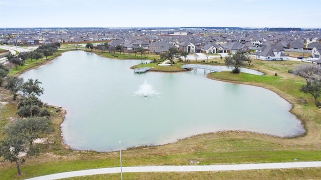 birds eye view of property with a water view and a residential view