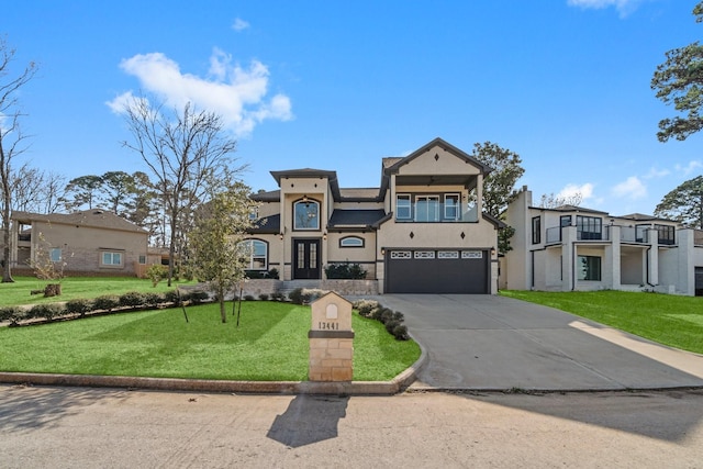 view of front facade with a garage, concrete driveway, a residential view, a front yard, and stucco siding