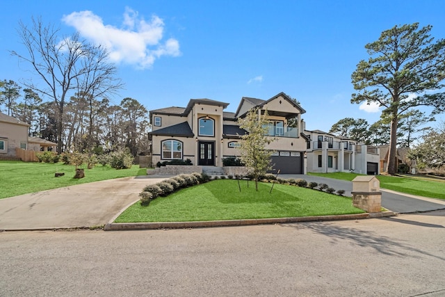 view of front of home featuring an attached garage, driveway, a residential view, stucco siding, and a front lawn