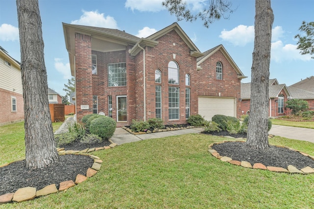 traditional home featuring a garage, brick siding, a front lawn, and fence