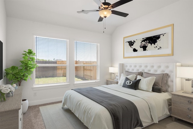 bedroom featuring vaulted ceiling, ceiling fan, baseboards, and light colored carpet