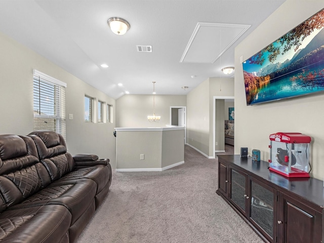 living room with light carpet, attic access, visible vents, baseboards, and lofted ceiling