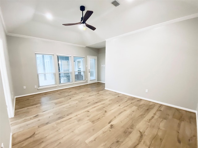 unfurnished room featuring crown molding, baseboards, visible vents, and light wood-style floors