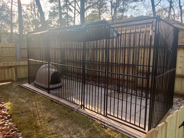 view of gate with fence