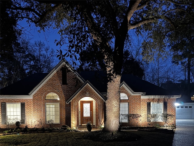 view of front of home with brick siding