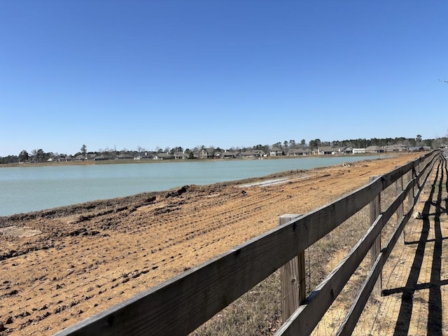 water view featuring fence