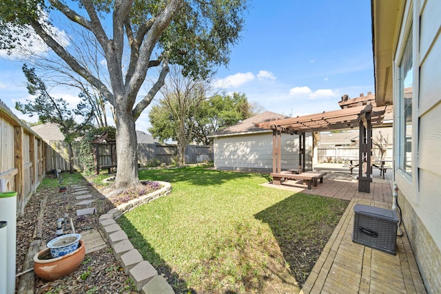 view of yard featuring a fenced backyard, a patio, and a pergola