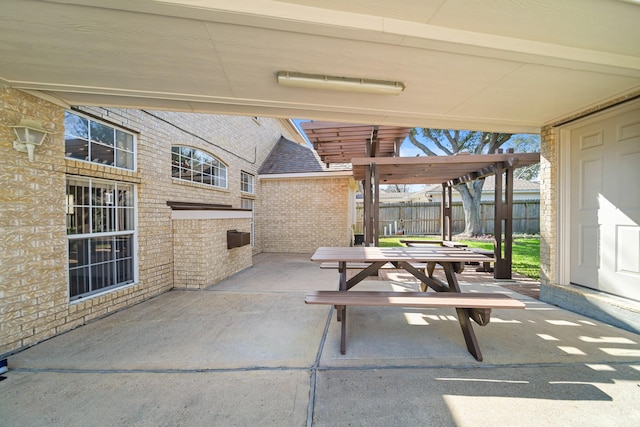 view of patio / terrace with fence and a pergola