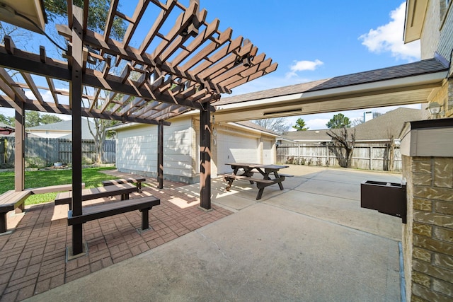 view of patio / terrace with a garage, outdoor dining space, a fenced backyard, and a pergola