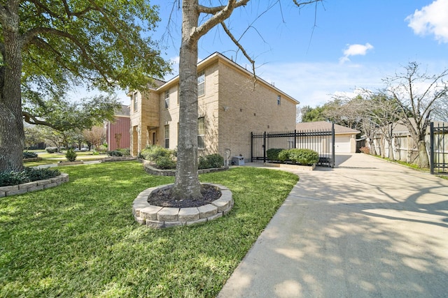 view of home's exterior featuring a yard, a residential view, brick siding, and fence