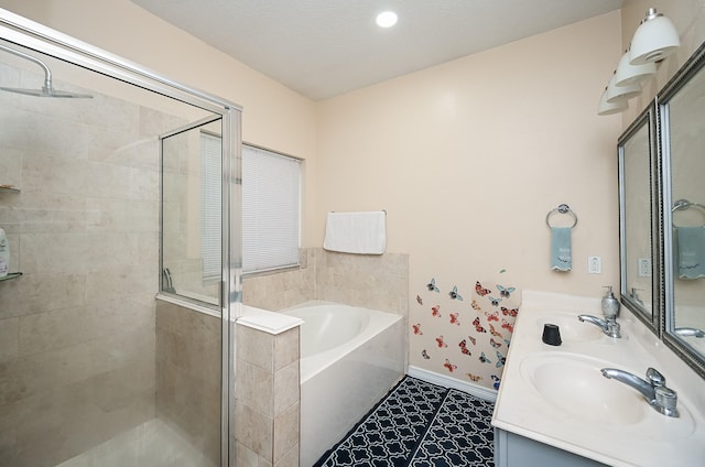 full bath with a stall shower, a garden tub, vanity, and baseboards