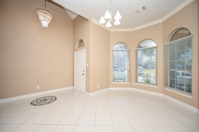 spare room featuring a chandelier, light tile patterned floors, visible vents, and baseboards