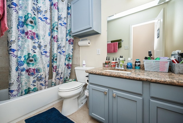 bathroom featuring toilet, tile patterned flooring, shower / bathtub combination with curtain, and vanity