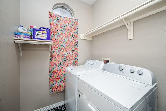 laundry area featuring laundry area, independent washer and dryer, and baseboards